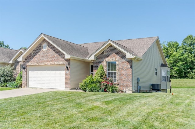 983 Fairway Dr, Union, MO 63084 - view of front of property with an attached garage, central AC, brick siding, a front lawn, and concrete driveway