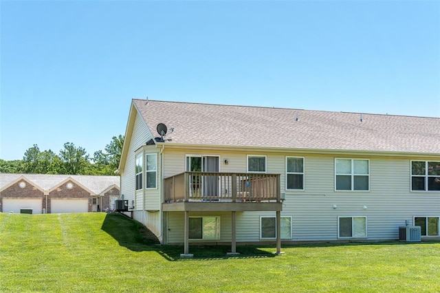 983 Fairway Dr, Union, MO 63084 - rear view of property featuring a lawn, central AC, and a wooden deck