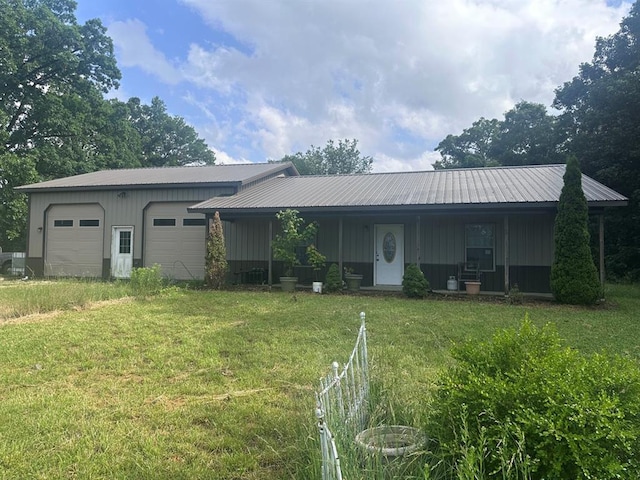 16439 State Highway Af, Dexter, MO 63841 - single story home with a front lawn, metal roof, a garage, and board and batten siding