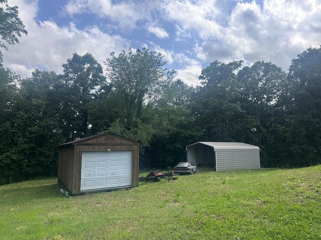 16439 State Highway Af, Dexter, MO 63841 - view of grassy yard with an outbuilding, a detached garage, a detached carport, and driveway