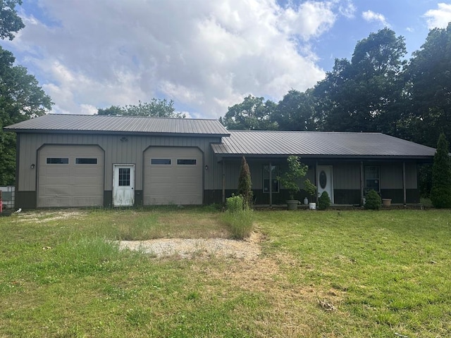 16439 State Highway Af, Dexter, MO 63841 - view of front facade with a front lawn, board and batten siding, metal roof, and a garage