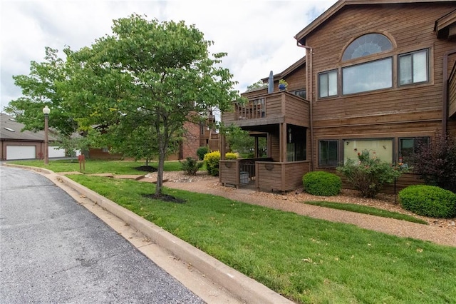 1001 Hemingway Ln Unit H, Weldon Spring, MO 63304 - view of side of property featuring a balcony and a yard