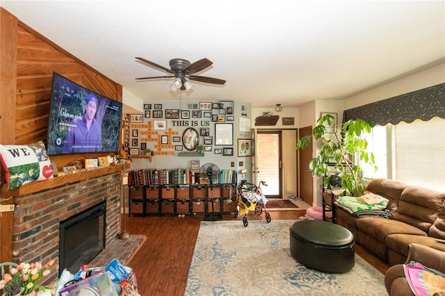 1001 Hemingway Ln Unit H, Weldon Spring, MO 63304 - living room featuring wood finished floors, a ceiling fan, and a fireplace