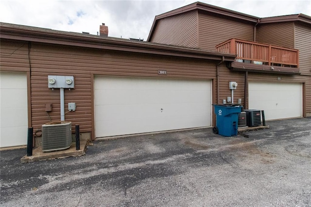 1001 Hemingway Ln Unit H, Weldon Spring, MO 63304 - garage with central AC unit