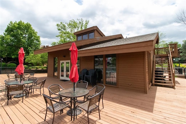 1001 Hemingway Ln Unit H, Weldon Spring, MO 63304 - wooden deck featuring outdoor dining space, stairs, and french doors