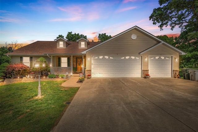1308 Maggie Cir, Bonne Terre, MO 63628 - view of front of house with a porch, driveway, a lawn, brick siding, and a garage