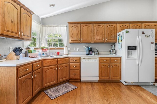 1308 Maggie Cir, Bonne Terre, MO 63628 - kitchen with white appliances, a sink, lofted ceiling, light countertops, and light wood-type flooring