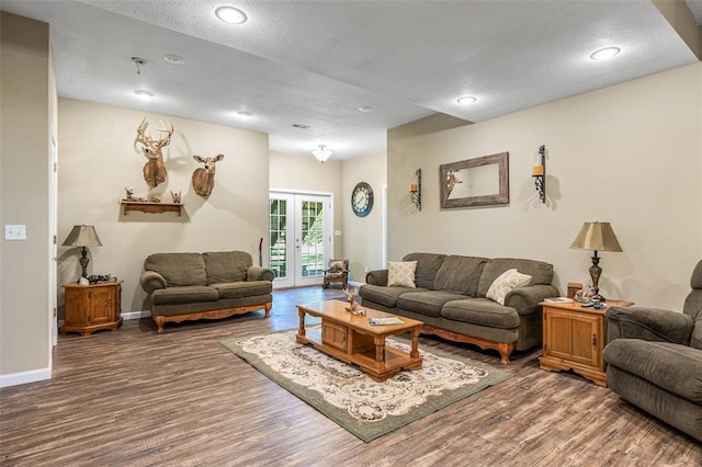 1308 Maggie Cir, Bonne Terre, MO 63628 - living room with french doors, wood finished floors, baseboards, recessed lighting, and a textured ceiling