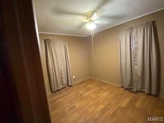 208 Edwards Ave, Sikeston, MO 63801 - empty room with ceiling fan, wood finished floors, baseboards, and ornamental molding