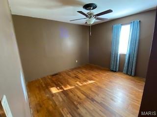 208 Edwards Ave, Sikeston, MO 63801 - spare room with ceiling fan and wood finished floors