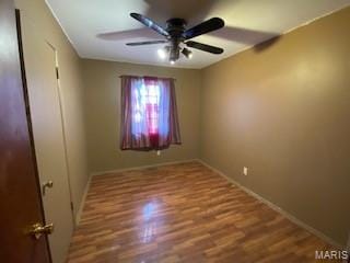 208 Edwards Ave, Sikeston, MO 63801 - empty room with a ceiling fan, wood finished floors, and baseboards