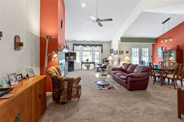 4501 Eli Dr I, Unit I, MO 63128 - living room featuring carpet, high vaulted ceiling, ceiling fan, and a fireplace
