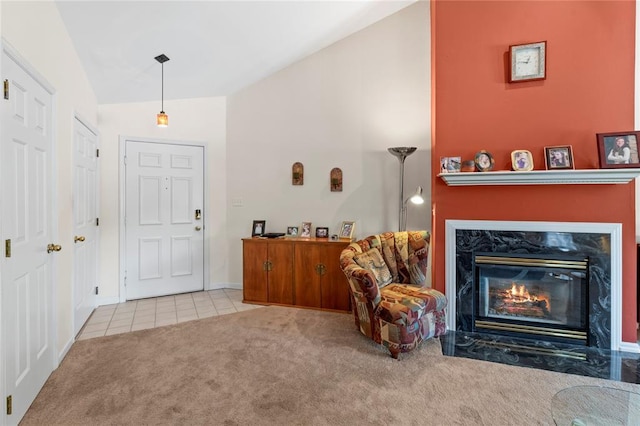 4501 Eli Dr I, Unit I, MO 63128 - carpeted entrance foyer featuring lofted ceiling, tile patterned flooring, a premium fireplace, and baseboards