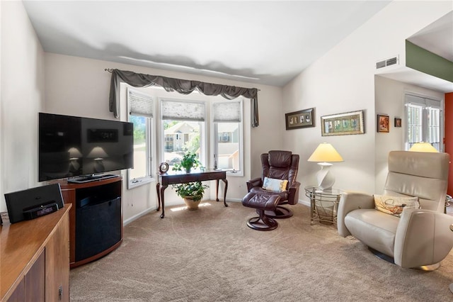 4501 Eli Dr I, Unit I, MO 63128 - living area with carpet, baseboards, and lofted ceiling