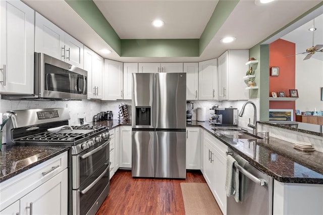 4501 Eli Dr I, Unit I, MO 63128 - kitchen featuring appliances with stainless steel finishes, a sink, white cabinetry, a peninsula, and recessed lighting