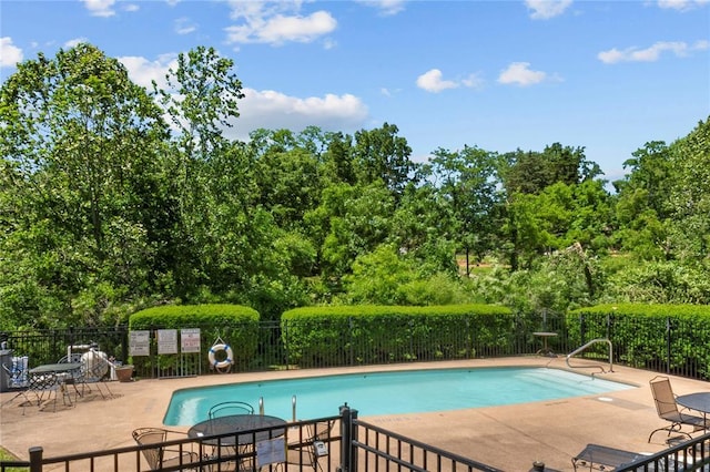 4501 Eli Dr I, Unit I, MO 63128 - community pool with a patio area and view of scattered trees