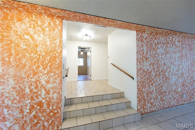 11230 W Little Oaks Rd, Rolla, MO 65401 - stairs with tile patterned flooring, wallpapered walls, ceiling fan, and baseboards