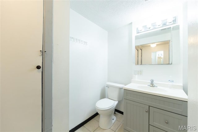 11230 W Little Oaks Rd, Rolla, MO 65401 - bathroom with toilet, vanity, tile patterned floors, and a textured ceiling
