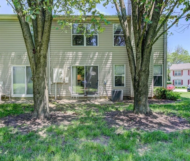 717 Sugar Glen Dr Unit 1, Saint Peters, MO 63376 - rear view of house with central air condition unit and a patio