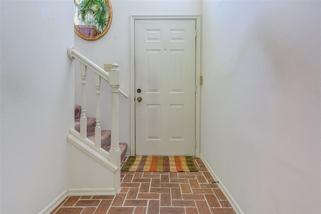 717 Sugar Glen Dr Unit 1, Saint Peters, MO 63376 - doorway featuring brick patterned flooring, stairway, and baseboards