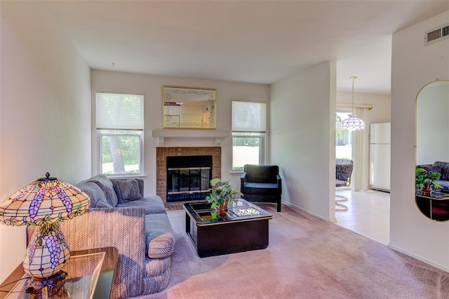 717 Sugar Glen Dr Unit 1, Saint Peters, MO 63376 - living area featuring carpet flooring, a fireplace, and baseboards