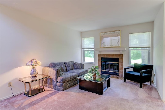 717 Sugar Glen Dr Unit 1, Saint Peters, MO 63376 - living area featuring carpet floors, plenty of natural light, a glass covered fireplace, and baseboards