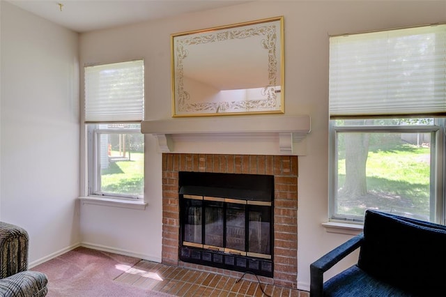 717 Sugar Glen Dr Unit 1, Saint Peters, MO 63376 - carpeted living room featuring a fireplace and baseboards