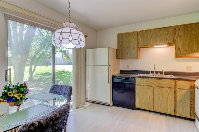 717 Sugar Glen Dr Unit 1, Saint Peters, MO 63376 - kitchen with dishwasher, freestanding refrigerator, a sink, dark countertops, and light wood-style flooring