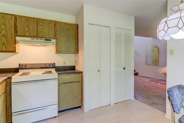 717 Sugar Glen Dr Unit 1, Saint Peters, MO 63376 - kitchen with under cabinet range hood, white range with electric cooktop, brown cabinets, light carpet, and dark countertops