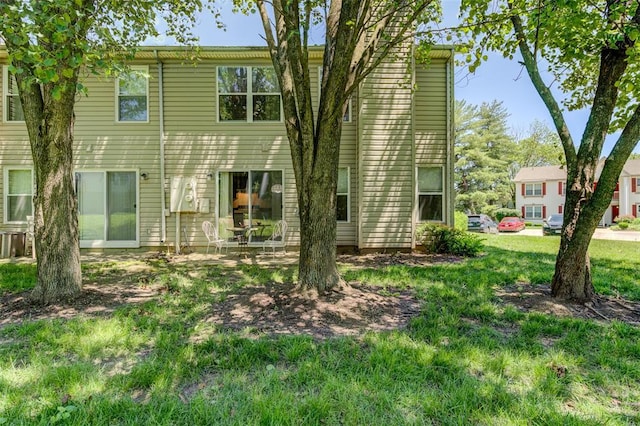 717 Sugar Glen Dr Unit 1, Saint Peters, MO 63376 - back of house featuring a lawn