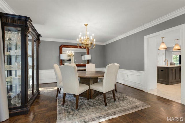 50 Lake Forest Dr, Richmond Heights, MO 63117 - dining space featuring a chandelier, wainscoting, ornamental molding, and a decorative wall