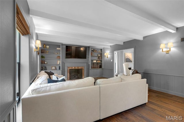 50 Lake Forest Dr, Richmond Heights, MO 63117 - living area featuring beam ceiling, dark wood finished floors, a brick fireplace, and wainscoting