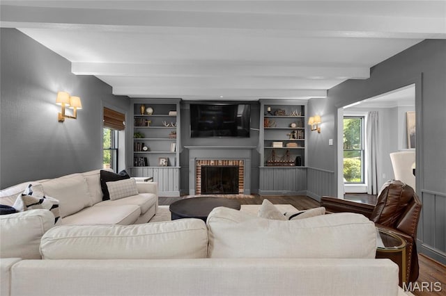 50 Lake Forest Dr, Richmond Heights, MO 63117 - living area featuring beamed ceiling, wood finished floors, plenty of natural light, and a fireplace