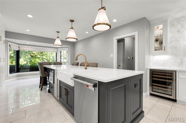 50 Lake Forest Dr, Richmond Heights, MO 63117 - kitchen with stainless steel dishwasher, beverage cooler, a sink, light marble finish floors, and recessed lighting