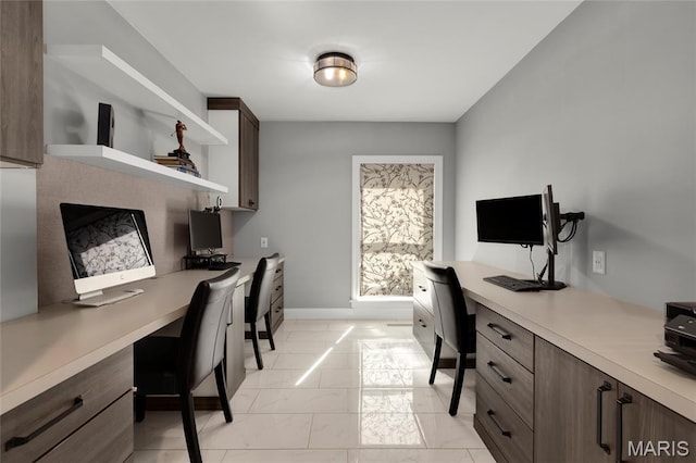 50 Lake Forest Dr, Richmond Heights, MO 63117 - office area with light marble finish flooring, built in study area, and baseboards