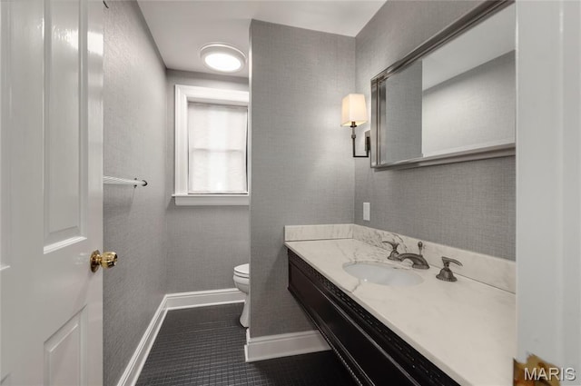 50 Lake Forest Dr, Richmond Heights, MO 63117 - bathroom with toilet, vanity, baseboards, and tile patterned floors