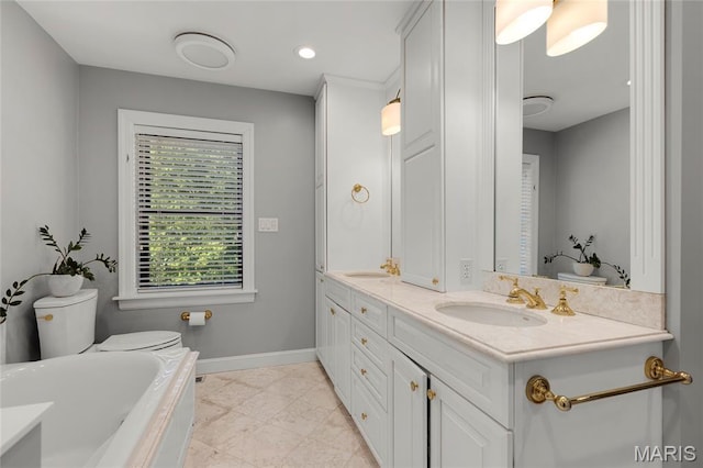 50 Lake Forest Dr, Richmond Heights, MO 63117 - bathroom with double vanity, a bath, baseboards, and recessed lighting