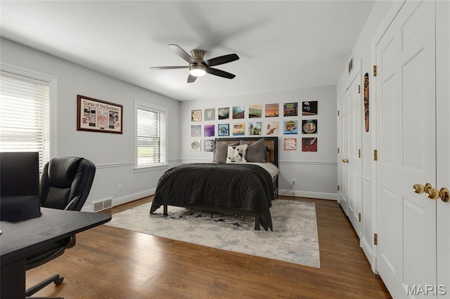 50 Lake Forest Dr, Richmond Heights, MO 63117 - bedroom with wood finished floors, a desk, baseboards, and ceiling fan