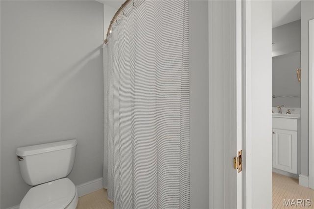 50 Lake Forest Dr, Richmond Heights, MO 63117 - full bathroom with toilet, vanity, tile patterned floors, curtained shower, and baseboards