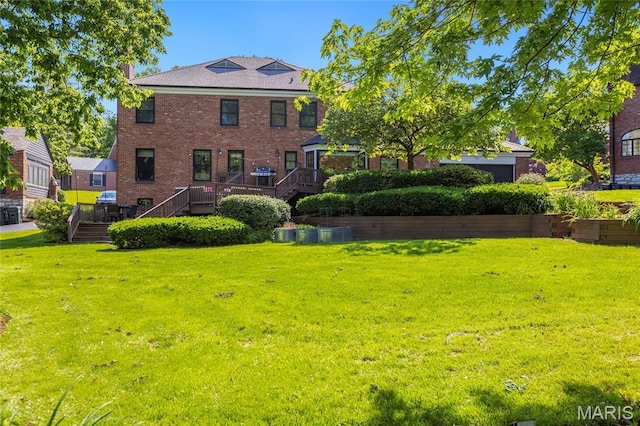50 Lake Forest Dr, Richmond Heights, MO 63117 - back of house with a lawn, brick siding, and stairs