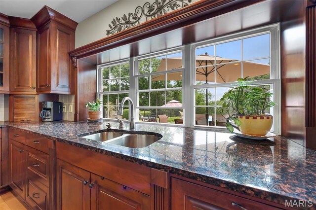 2785 Marble Springs Rd, Barnhart, MO 63012 - kitchen with a sink, healthy amount of natural light, dark stone countertops, and backsplash