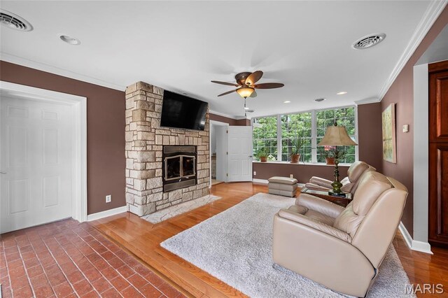 2785 Marble Springs Rd, Barnhart, MO 63012 - living room featuring crown molding, baseboards, a ceiling fan, a fireplace, and recessed lighting
