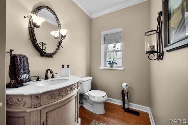 2785 Marble Springs Rd, Barnhart, MO 63012 - half bathroom with crown molding, toilet, wood finished floors, vanity, and baseboards