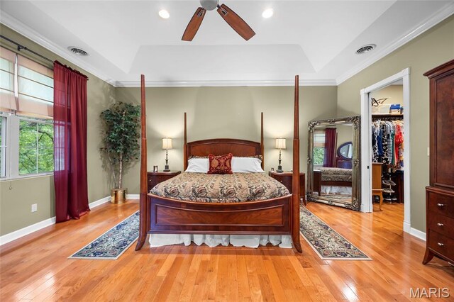 2785 Marble Springs Rd, Barnhart, MO 63012 - bedroom with a raised ceiling, wood-type flooring, a walk in closet, ornamental molding, and ceiling fan