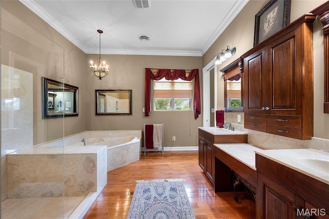 2785 Marble Springs Rd, Barnhart, MO 63012 - bathroom featuring wood-type flooring, double vanity, a bath, a chandelier, and crown molding