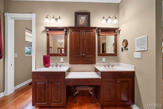 2785 Marble Springs Rd, Barnhart, MO 63012 - full bath featuring double vanity, wood finished floors, and baseboards