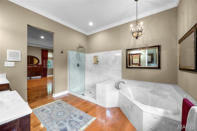 2785 Marble Springs Rd, Barnhart, MO 63012 - bathroom featuring ornamental molding, a chandelier, a garden tub, wood finished floors, and walk in shower