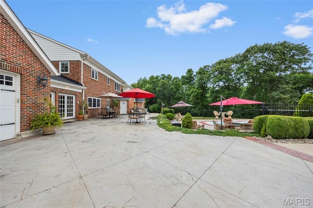 2785 Marble Springs Rd, Barnhart, MO 63012 - fenced backyard featuring outdoor dining space, a patio area, and a hot tub