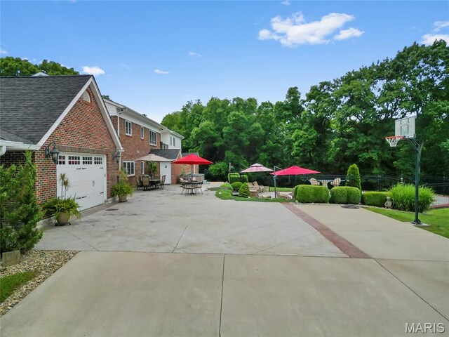 2785 Marble Springs Rd, Barnhart, MO 63012 - view of side of property featuring concrete driveway, brick siding, outdoor dining area, and a garage