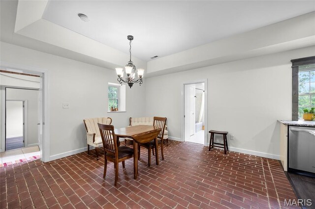 2785 Marble Springs Rd, Barnhart, MO 63012 - dining area with brick patterned floors, baseboards, and a chandelier